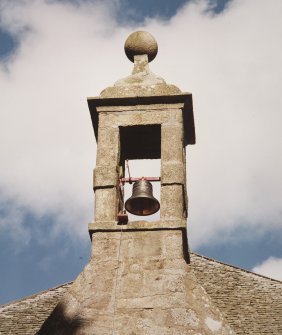 West wall, bellcote crowned by ball finial, detail