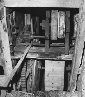 Detail of threshing machine in barn.