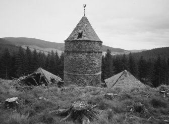 Elevated view from NW, showing the central tower and the slated roofs of its two adjacent 'pavilions'