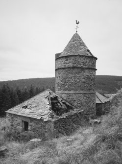 View from N, showing the central tower and wind vane, and its two adjacent 'pavilions'