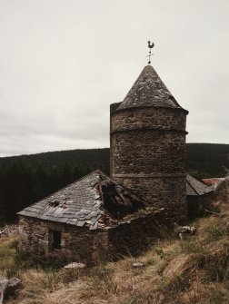 View from N, showing the central tower and wind vane, and its two adjacent 'pavilions'