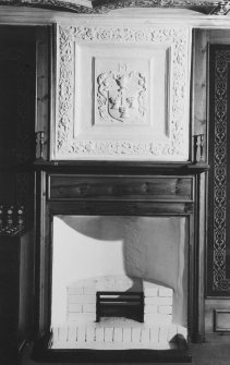 Interior.
View of plaster armorial panel above fireplace in SE compartment, fourth floor.