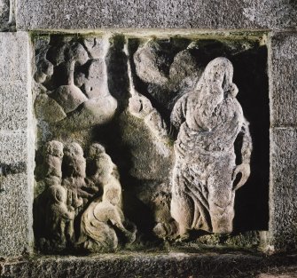 Detail of carved panel on right of well head depicting Moses striking the rock