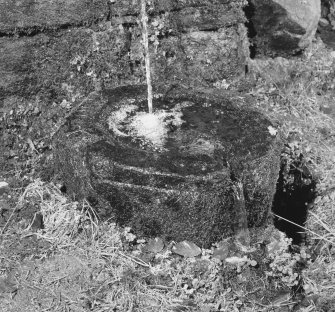 Detail of font collecting water below fountain