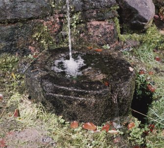 Detail of font collecting water below fountain