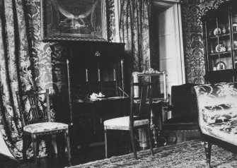 Interior. Drawing room, showing an open writing desk.