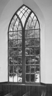 Interior. Detail of clear glazed pointed arch window