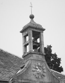 Birdcage bellcote, with clock and 1804 datestone