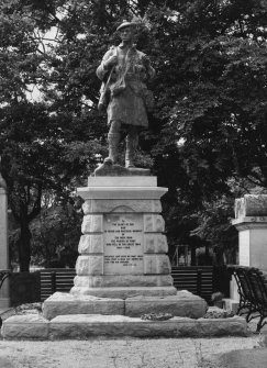 View of statue with inscription on base "To The Glory of God and in Proud and Grateful Memory of the Men From the Parish of Echt Who Fell in the Great War 1914-1918. Greater Love Hath no Man Than This, That a Man Lay Down His Life for His Friends" from N