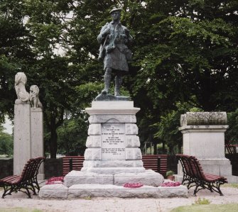 View of statue with inscription on base "To The Glory of God and in Proud and Grateful Memory of the Men From the Parish of Echt Who Fell in the Great War 1914-1918. Greater Love Hath no Man Than This, That a Man Lay Down His Life for His Friends" from N