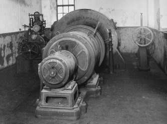 Interior.
View of turbine and generator plant (1923) with generator and auxiliary in foreground.