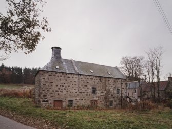General view of mill from NW, showing kiln (left) and water wheel (right)