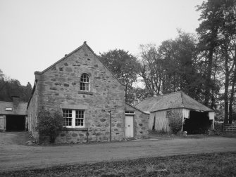 View from S of S gable of SE leg of steading and adjacent wood shed.