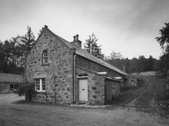 View from SE along E side of steading, showing (halfway up) water-wheel house (water wheel, which drove the threshing barn has been removed).