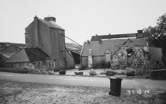 General view from N of detached kiln (left) and 'L'-plan water-powered grain mill (right), with recently added sheds to rear.