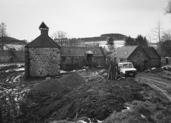 View from NE of NE side of mill, also showing adjacent buildings (right)