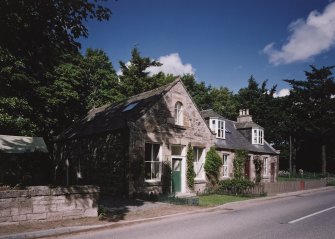 View of cottage and former shop at Bridgend to East of West Lodge from SW.