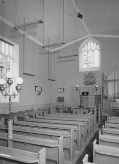 Interior.
View from SE showing pews, organ and communion table.