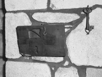 Interior.
Detail of lock and key on W wall of first floor vestibule S arch.