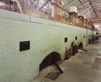 Interior.
Still House: view from NE at lower level showing fireboxes beneath stills.