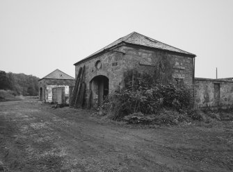 View from S of steading, showing two pavilions, one at each end of SW side of steading.