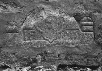 Kirkton of Premnay, Old Parish Church: fragment of belfry or pediment built into churchyard wall.
