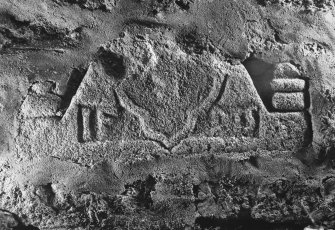 Kirkton of Premnay, Old Parish Church: fragment of belfry or pediment built into churchyard wall.
