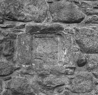 Kinkell, St Michael's Church and burial-ground: detail of weathered carved panel in N wall.
