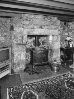 Interior. Detail of cottage sitting room fireplace