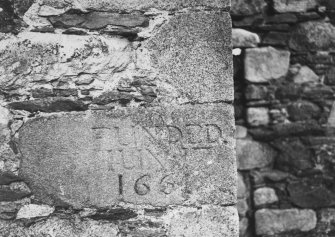 Leslie Castle. Detail of inscribed stone in angle of projection.