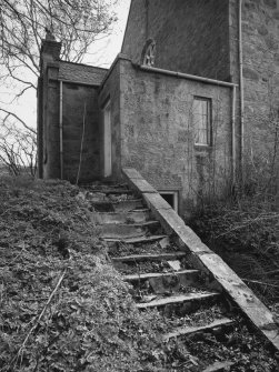 Detail of steps leading to session house abutting N gable.