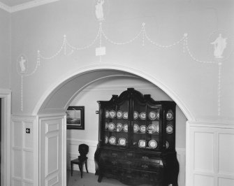 Leith Hall, interior.  First floor (West block).  Landing: detail of plasterwork above arch