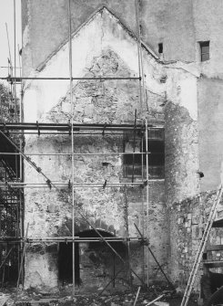 View of West wall showing kitchen fireplace on external wall.