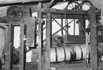 Detail of assorted mill machinery, including reciprocating sieve and seed dresser.