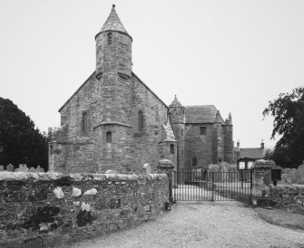 View from West showing gates and graveyard wall.