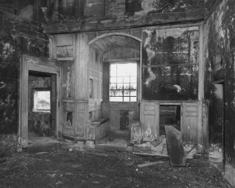 Interior, tower house.
Detail showing surviving panelling in West wall and window embrasure on first floor.