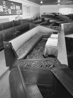 Laird's pew in gallery with padded seats and bibles