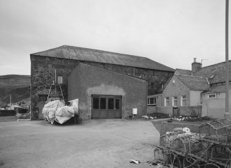 General view from E, showing the former granary block forming the E side of the building (now used as workshop and store for cabinet maker, but previously converted to ice store for white fish following erection of fish processing works on W side in 1896)