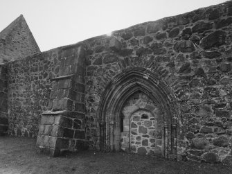 Detail of blocked entrance and buttress on North wall