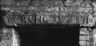 Detail of lintel inscribed: ' W  R HG 1687 ' in North range on first floor.