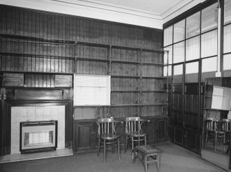 Interior. View of shop fittings and fireplace from W