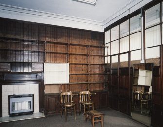 Interior. View of shop fittings and fireplace from W