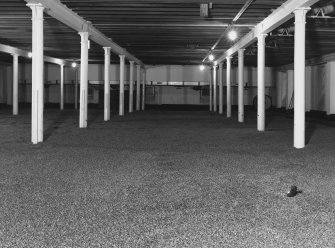 Interior.
View from WNW in Maltings of newly laid floor of barley.