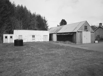 General view from S of blocks containing WC, Store and Garage (for tractor) situated at NW end of distillery complex.