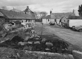 General view from S showing yard, steading and cottage.