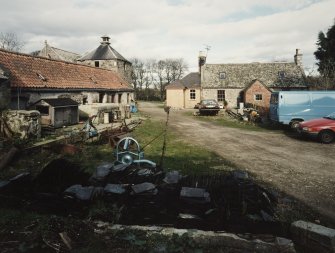 General view from S showing yard, steading and cottage.