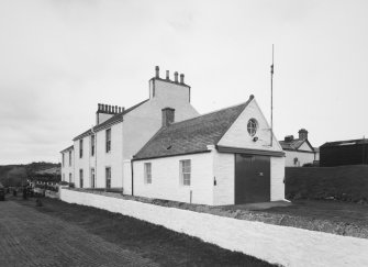 General view of coastguard station and houses from SE