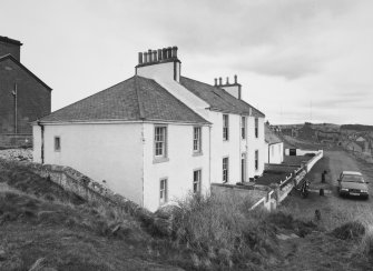 View of houses at N end of coastguard station from W