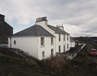 View of houses at N end of coastguard station from W