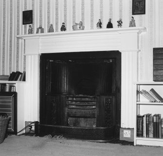 Interior.  First floor Upper level suite. Study. Detail of fireplace with register grate